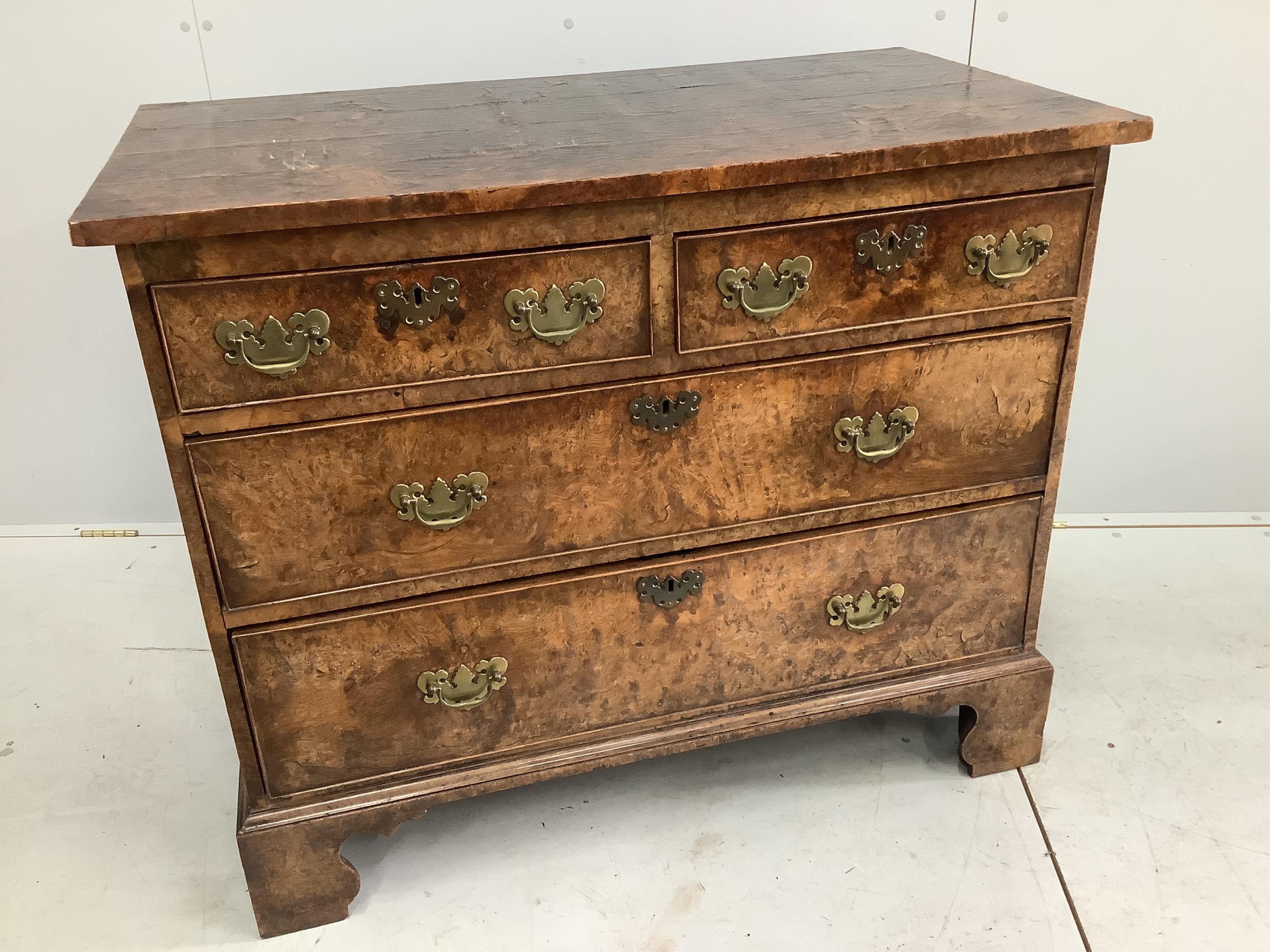 A George III burr elm chest of drawers, width 105cm, depth 57cm, height 86cm. Condition - fair